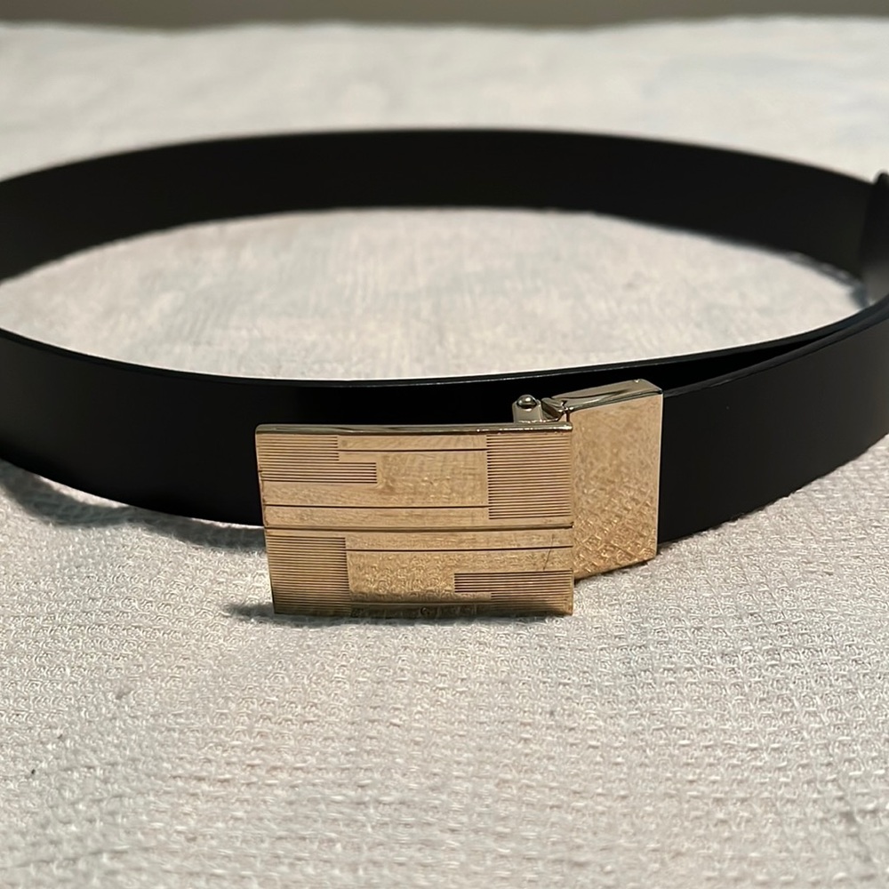 Dark brown Gucci belt with gold buckle